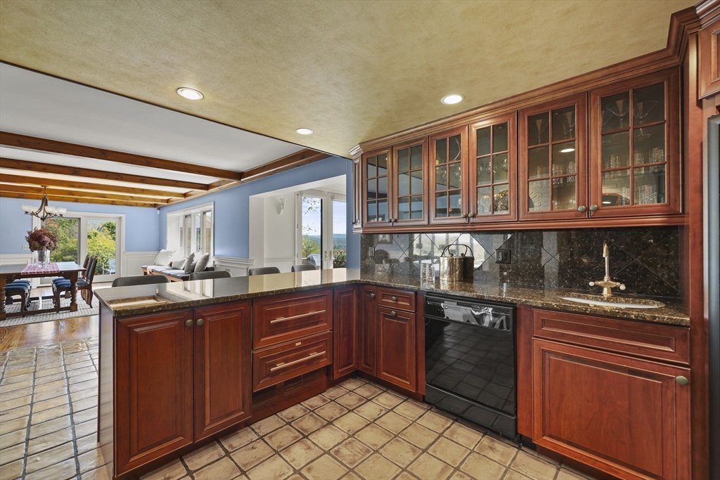 60 Old Cheshire Road Lanesborough, MA 01237 - Photo 21 of 42 a kitchen with stainless steel appliances granite countertop cabinets and window
