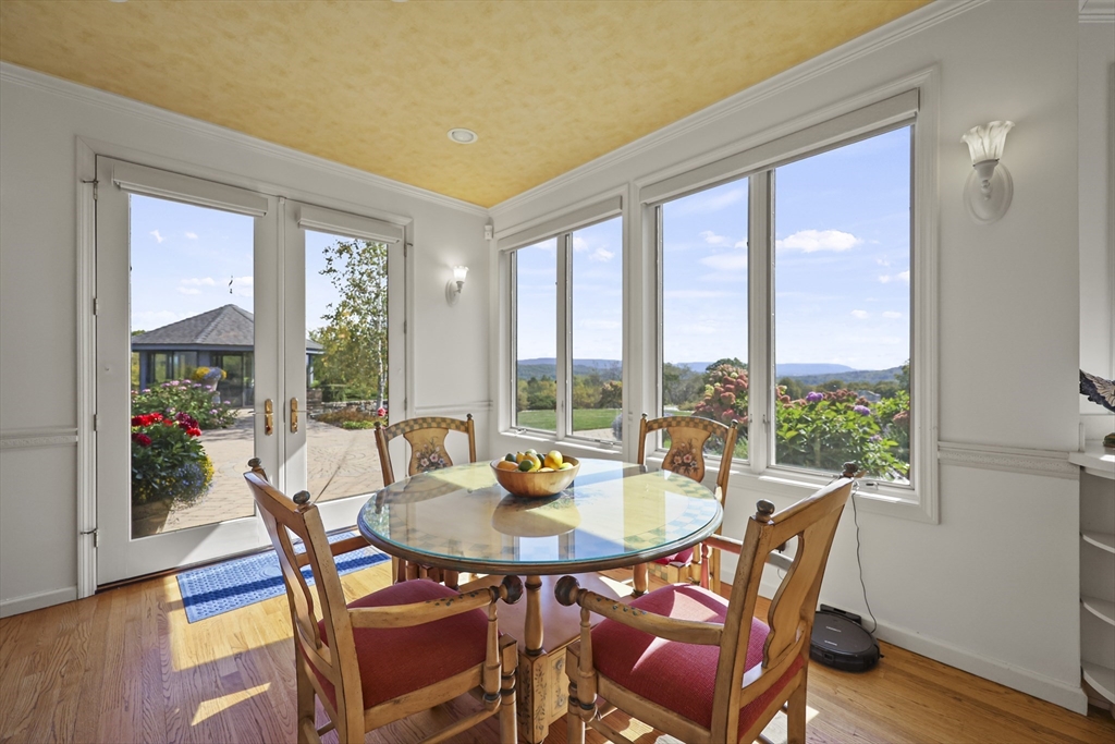 60 Old Cheshire Road Lanesborough, MA 01237 - Photo 22 of 42 a dining room with furniture window and wooden floor