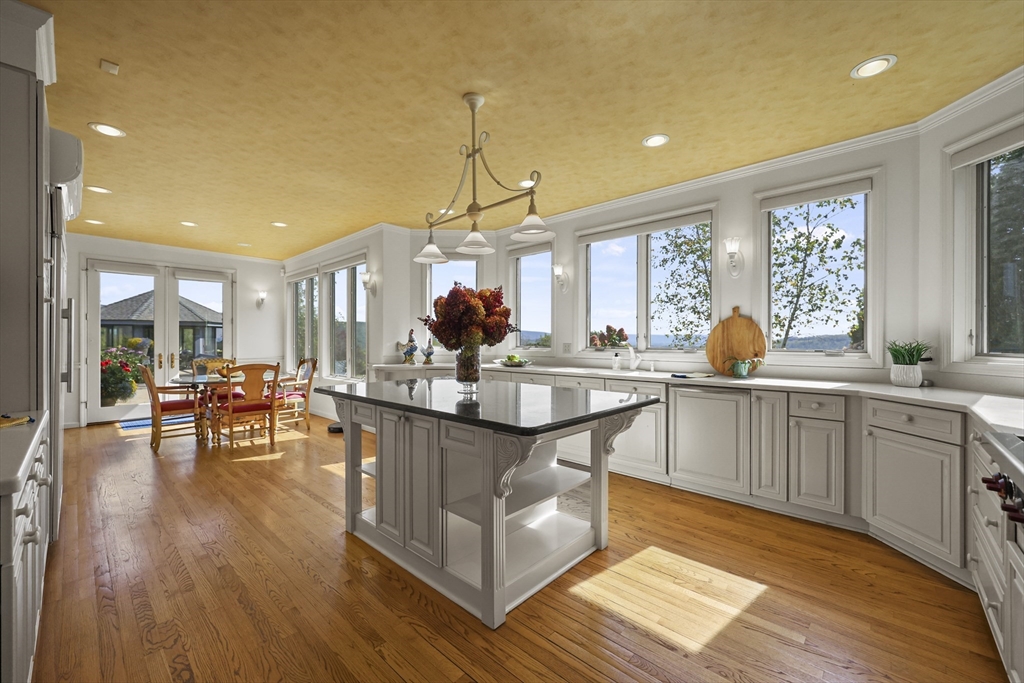 60 Old Cheshire Road Lanesborough, MA 01237 - Photo 26 of 42 a kitchen with counter and wooden floor