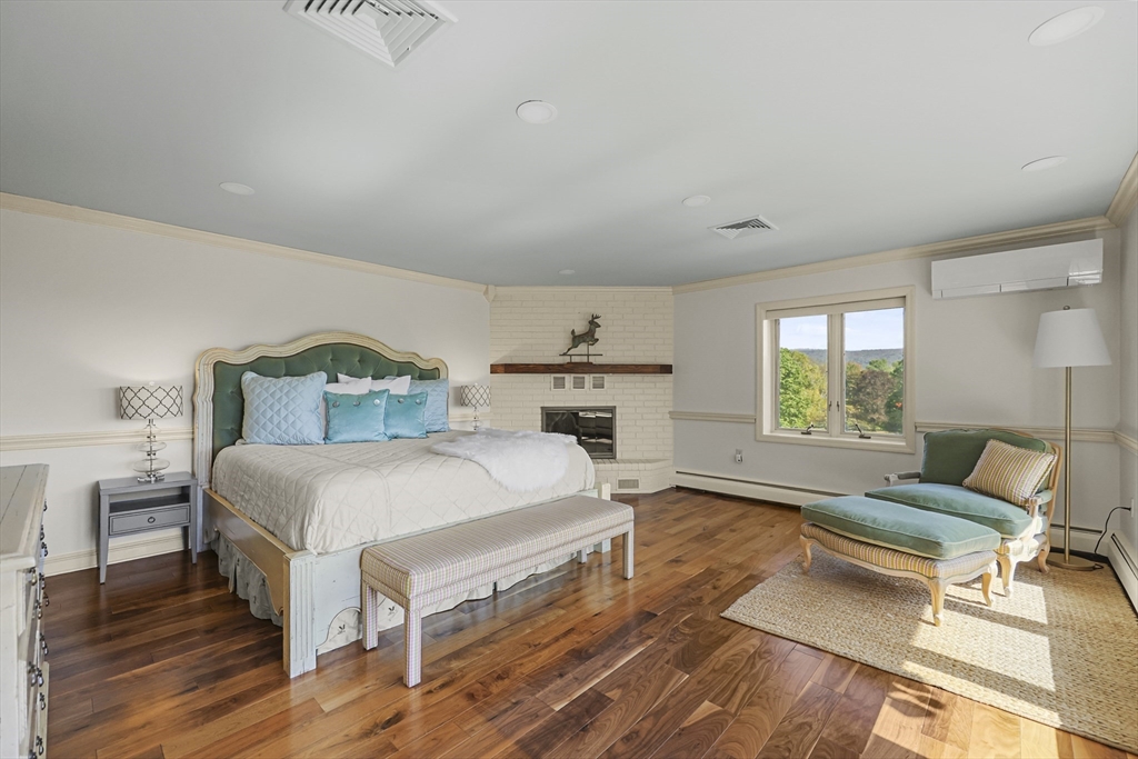 60 Old Cheshire Road Lanesborough, MA 01237 - Photo 29 of 42 a bedroom with a bed a table and chair