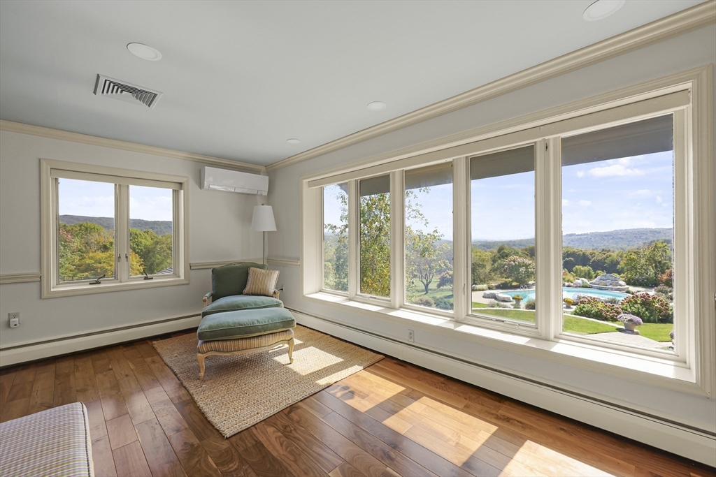 60 Old Cheshire Road Lanesborough, MA 01237 - Photo 31 of 42 a living room with hardwood floor and large windows