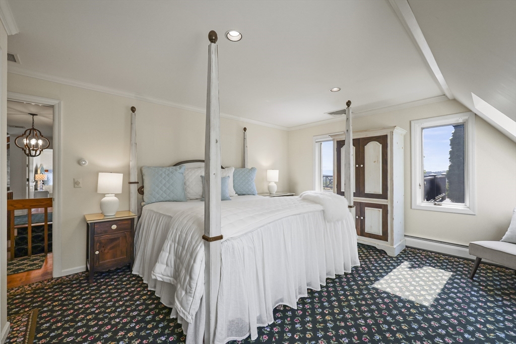 60 Old Cheshire Road Lanesborough, MA 01237 - Photo 35 of 42 a bedroom with a bed and cabinets