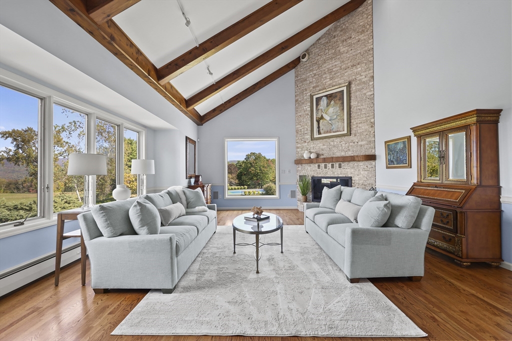 60 Old Cheshire Road Lanesborough, MA 01237 - Photo 9 of 42 a living room with furniture fireplace and window