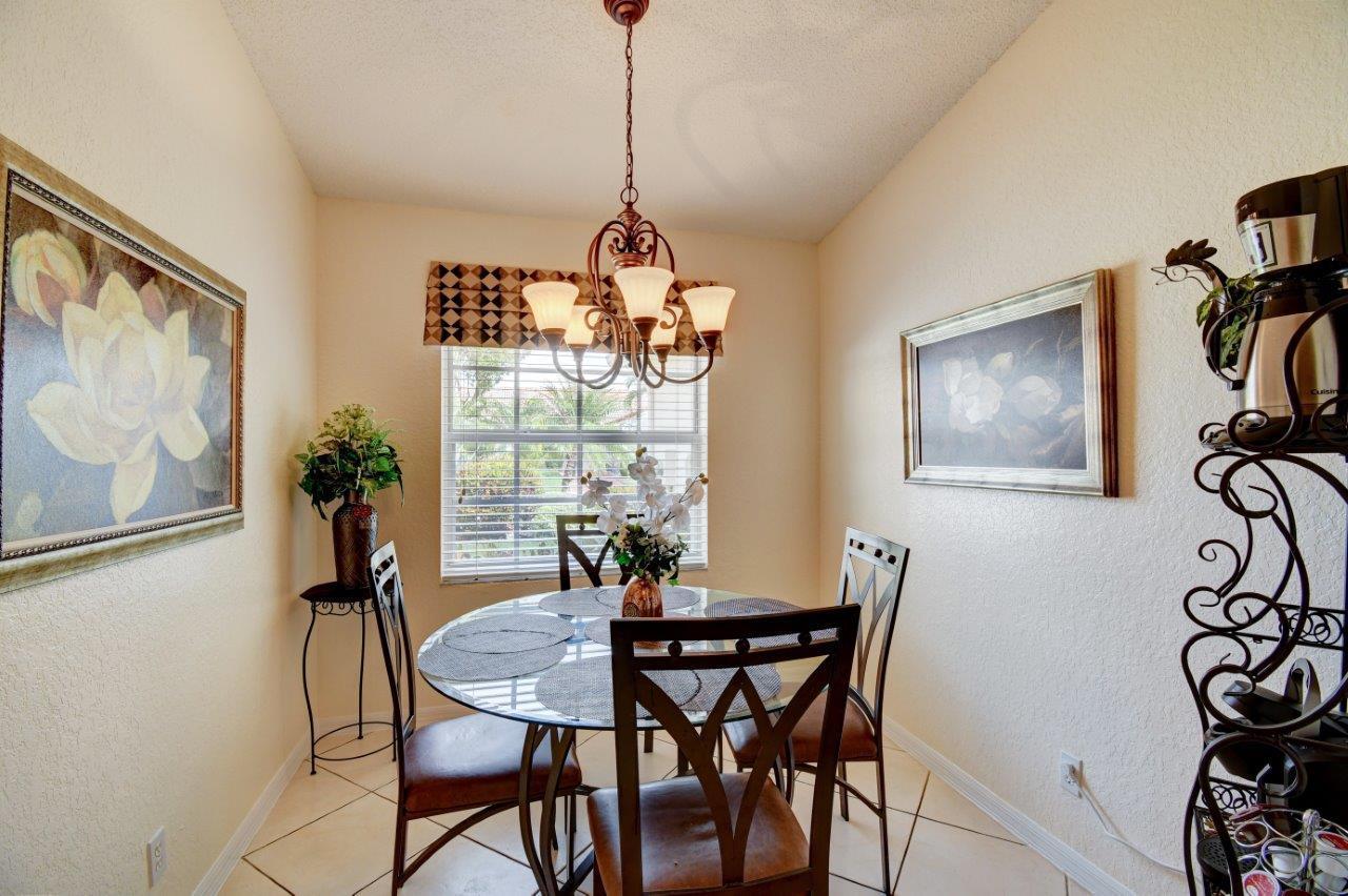 6104 Caladium Road Delray Beach, FL 33484 - Photo 11 of 43 a dining room with furniture and window