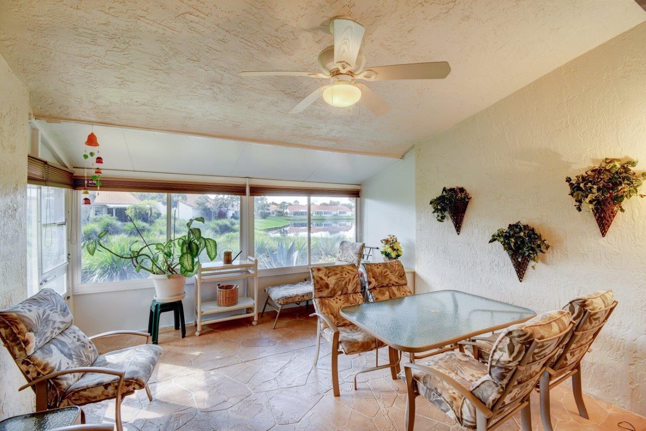 6104 Caladium Road Delray Beach, FL 33484 - Photo 21 of 43 a room with a table and chairs