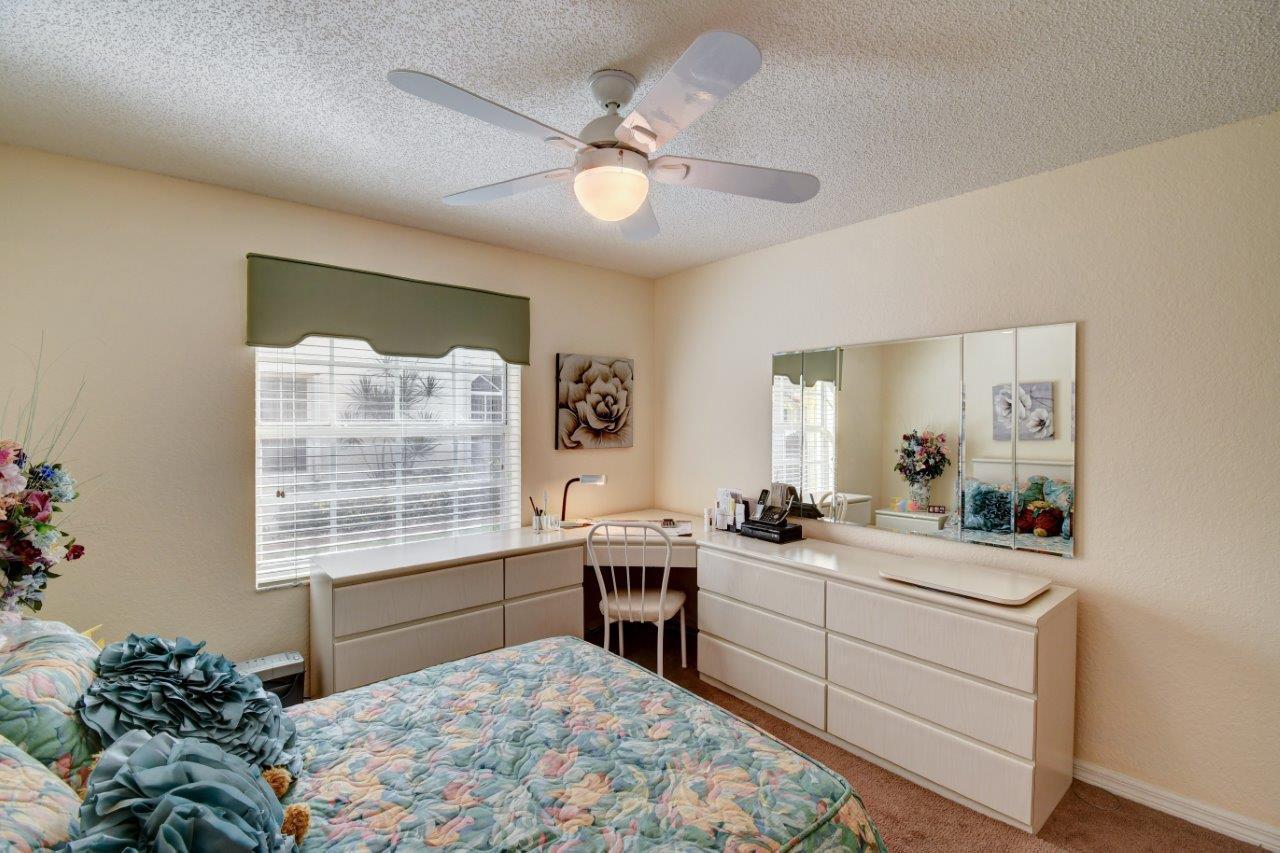 6104 Caladium Road Delray Beach, FL 33484 - Photo 26 of 43 a room with a bed and a window