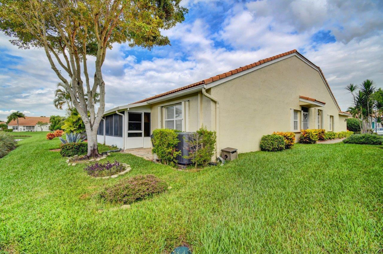 6104 Caladium Road Delray Beach, FL 33484 - Photo 30 of 43 a view of house with backyard