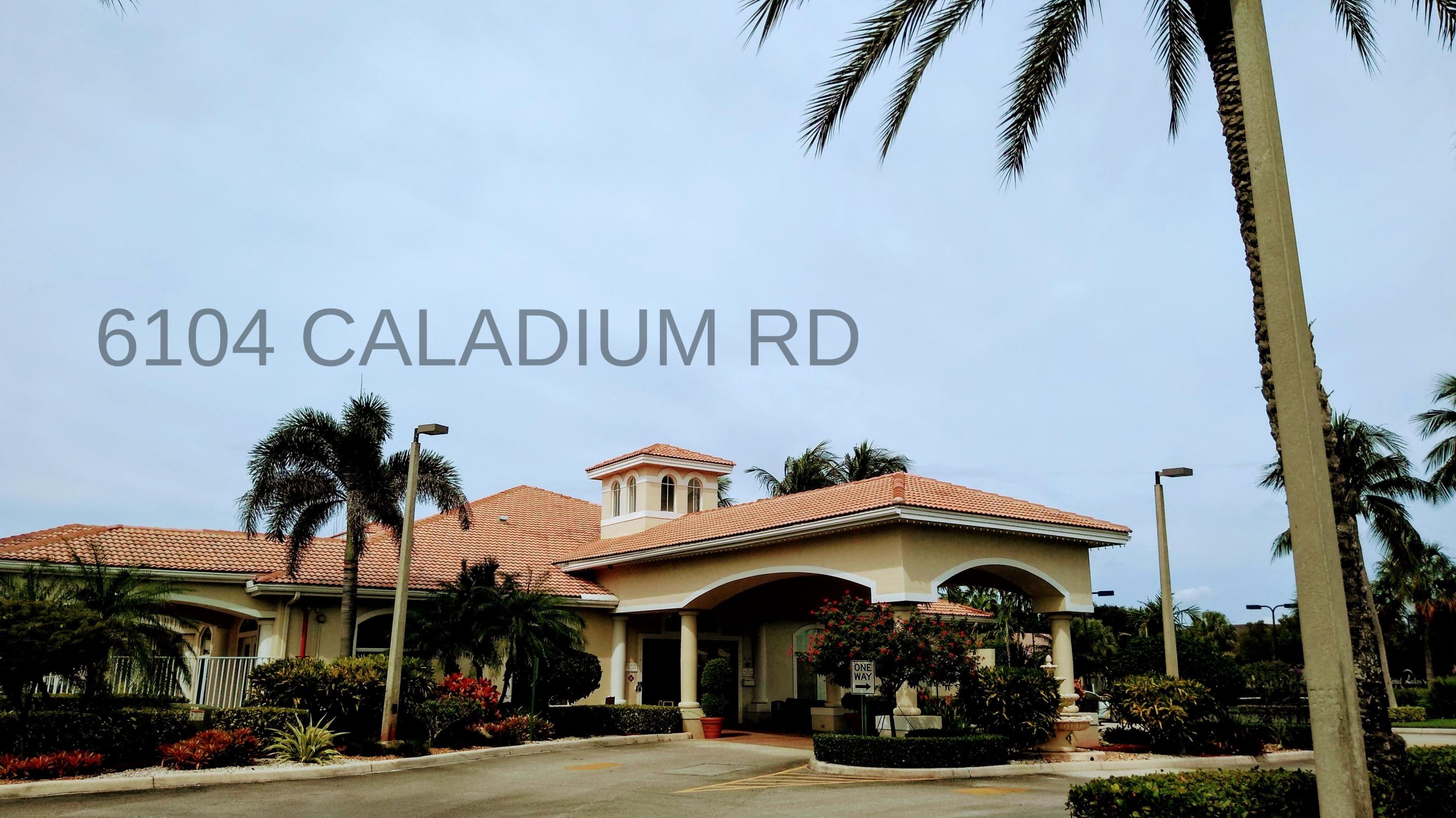 6104 Caladium Road Delray Beach, FL 33484 - Photo 33 of 43 a front view of a building with retail shops