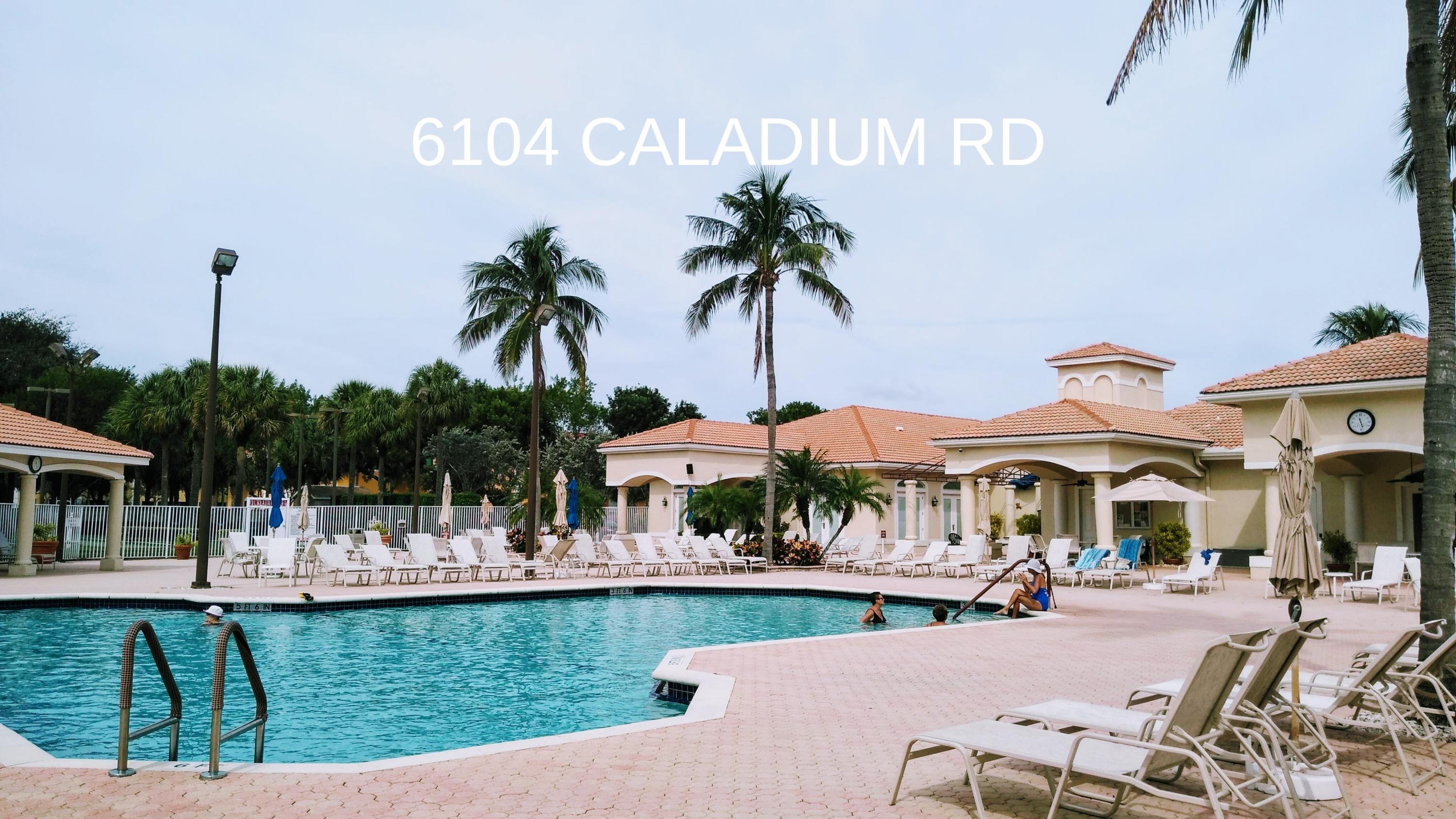 6104 Caladium Road Delray Beach, FL 33484 - Photo 34 of 43 a view of a swimming pool with outdoor seating