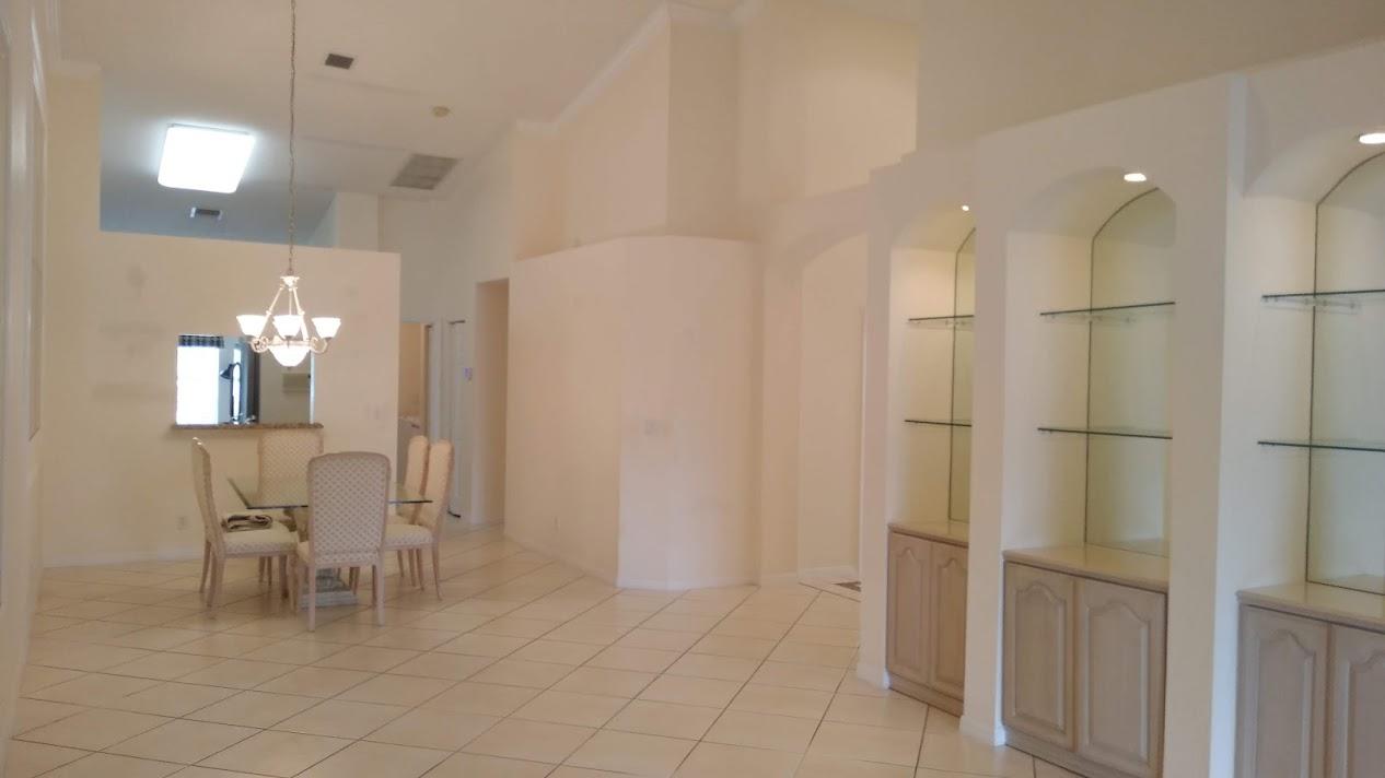 6104 Caladium Road Delray Beach, FL 33484 - Photo 38 of 43 a bathroom with a mirror and a shower