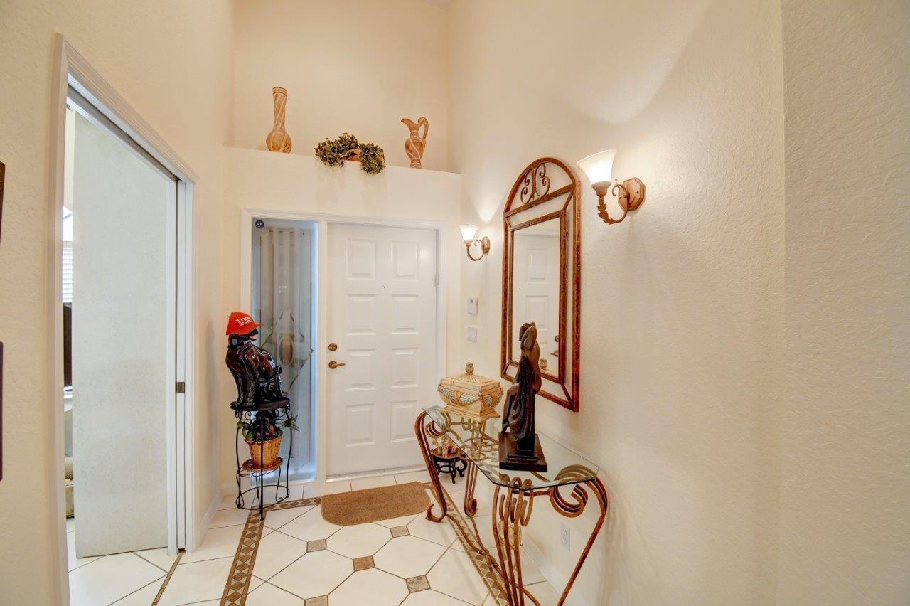 6104 Caladium Road Delray Beach, FL 33484 - Photo 5 of 43 a view of entryway with livingroom