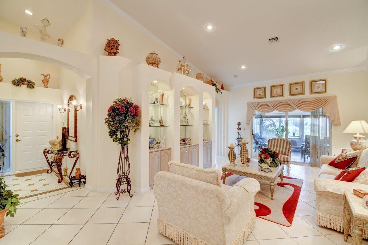 6104 Caladium Road Delray Beach, FL 33484 - Photo 8 of 43 a living room with furniture and a chandelier