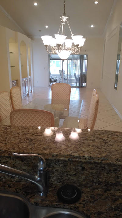 6104 Caladium Road Delray Beach, FL 33484 - Photo 9 of 43 a view of kitchen and dining room