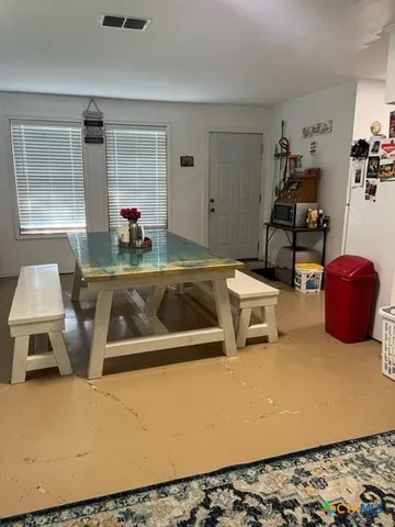 a kitchen with a stove and a refrigerator