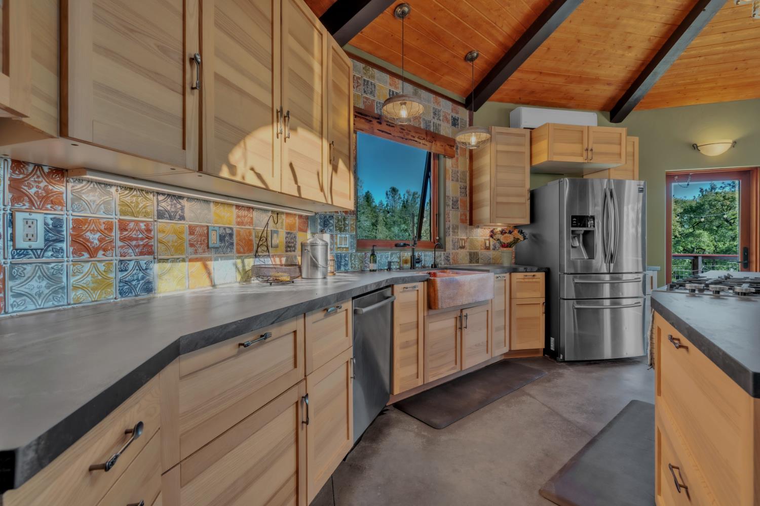 12767 Newtown Road Nevada City, CA 95959 - Photo 7 of 57 a kitchen with sink cabinets and window
