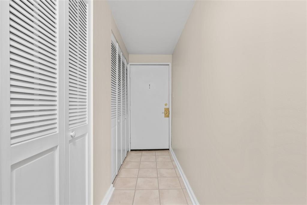 1500 Cochran Road, Unit 908 Pittsburgh, PA 15243 - Photo 6 of 27 A coat closet and the water heater are behind these two closet doors.