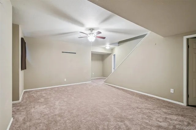 a view of a big room with windows and closet