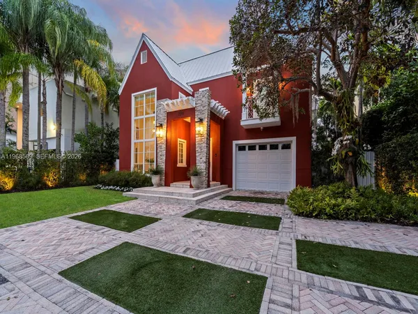a front view of a house with garden