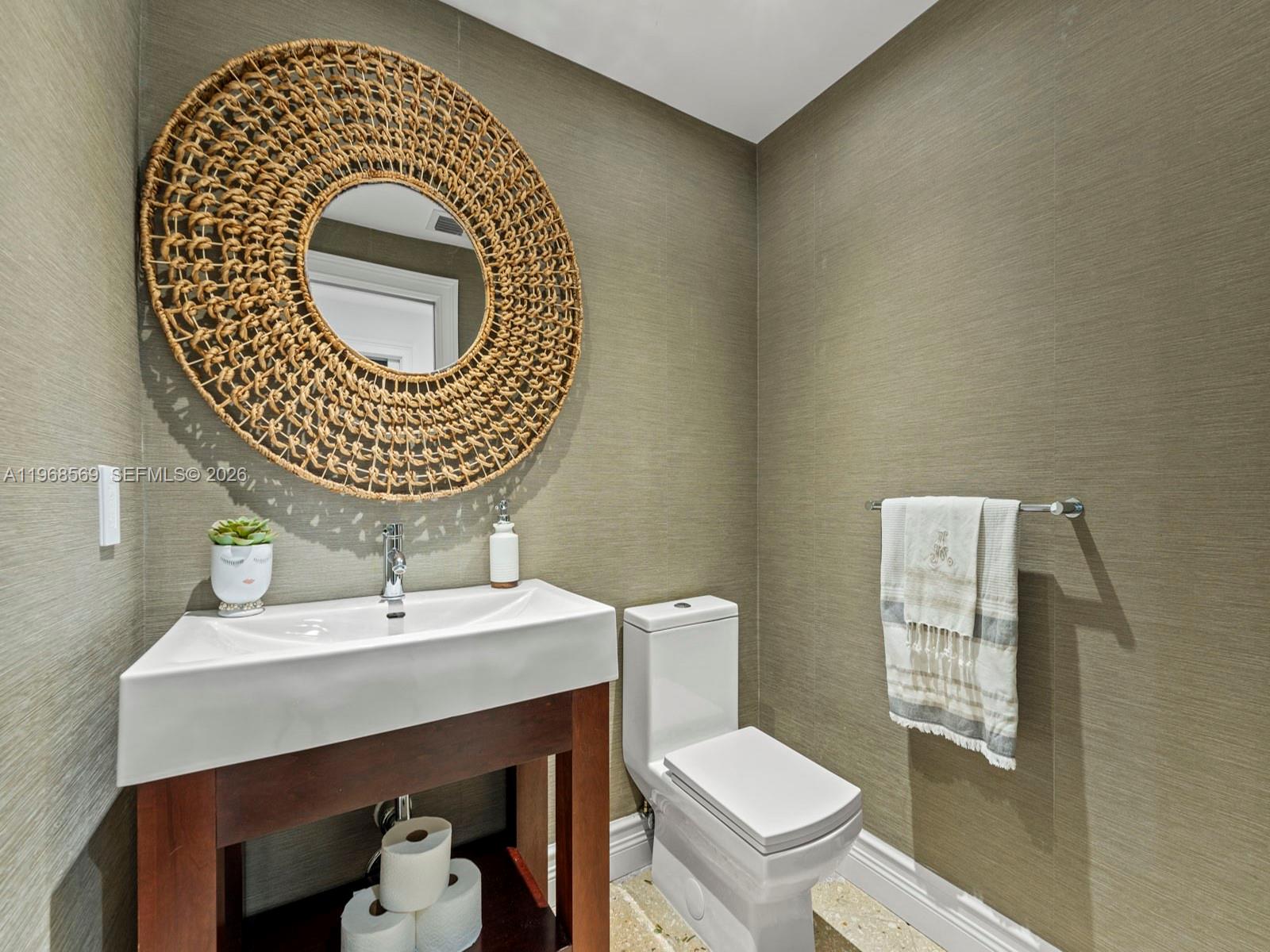 7218 Southwest 54th Court Miami, FL 33143 - Photo 13 of 47 a bathroom with a toilet a sink and mirror