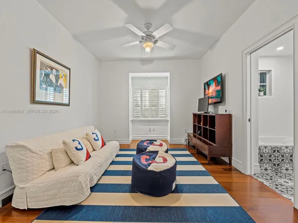 a living room with furniture and a rug