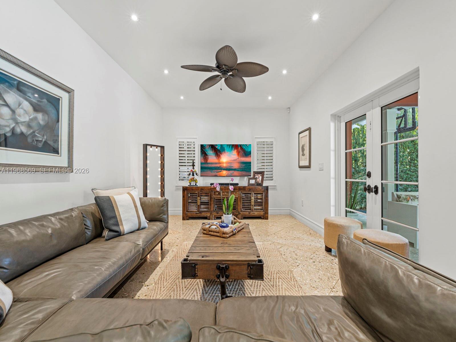 7218 Southwest 54th Court Miami, FL 33143 - Photo 16 of 47 a living room with furniture and a large window