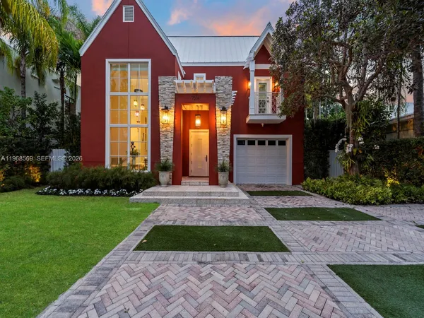 a front view of a house with yard