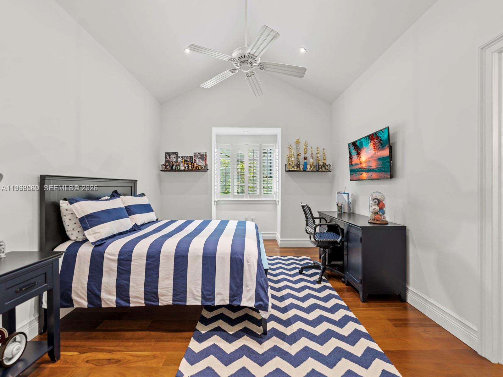 7218 Southwest 54th Court Miami, FL 33143 - Photo 25 of 47 a bed room with a bed and a chandelier