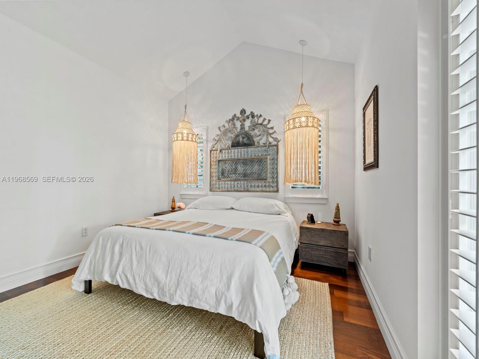7218 Southwest 54th Court Miami, FL 33143 - Photo 32 of 47 a bedroom with a bed mirror and window