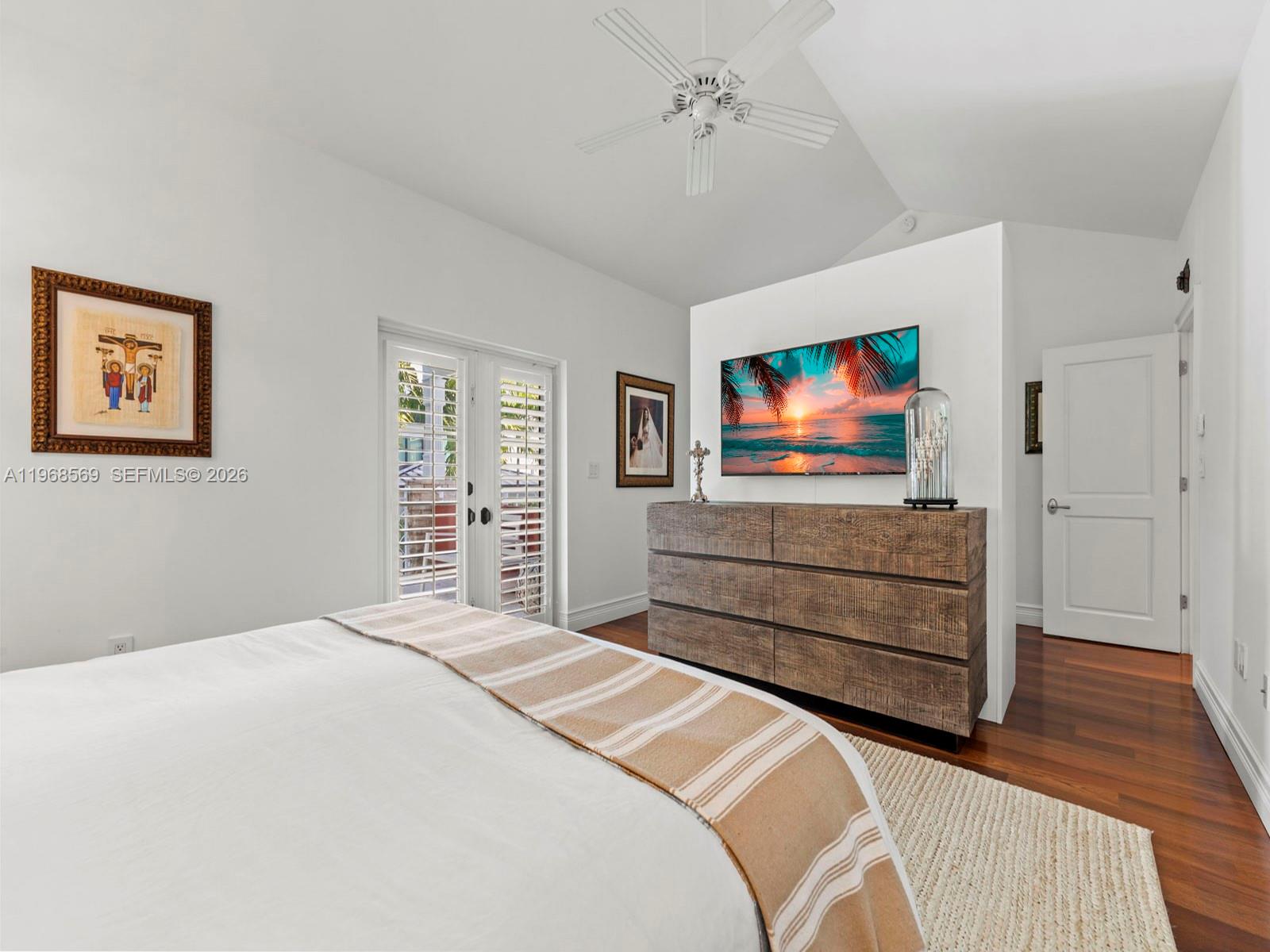 7218 Southwest 54th Court Miami, FL 33143 - Photo 33 of 47 a bedroom with a bed and a flat screen tv