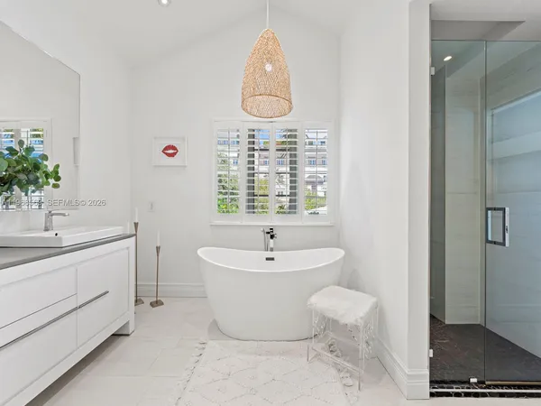 a bathroom with a sink toilet and a mirror