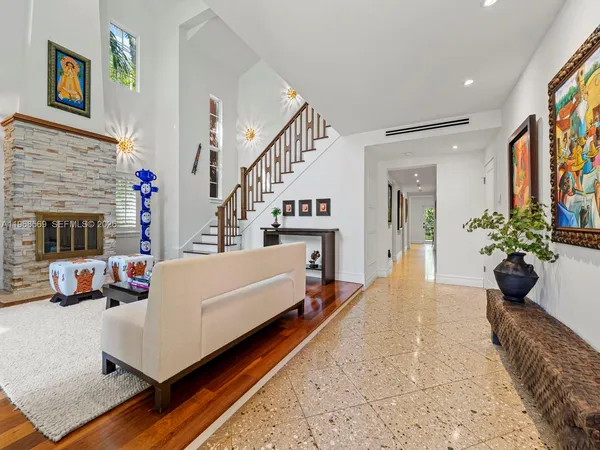 a living room with furniture and a fireplace