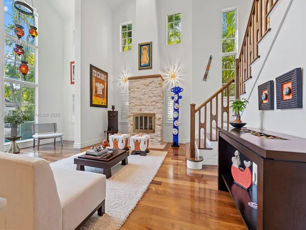 a living room with fireplace furniture and a couch