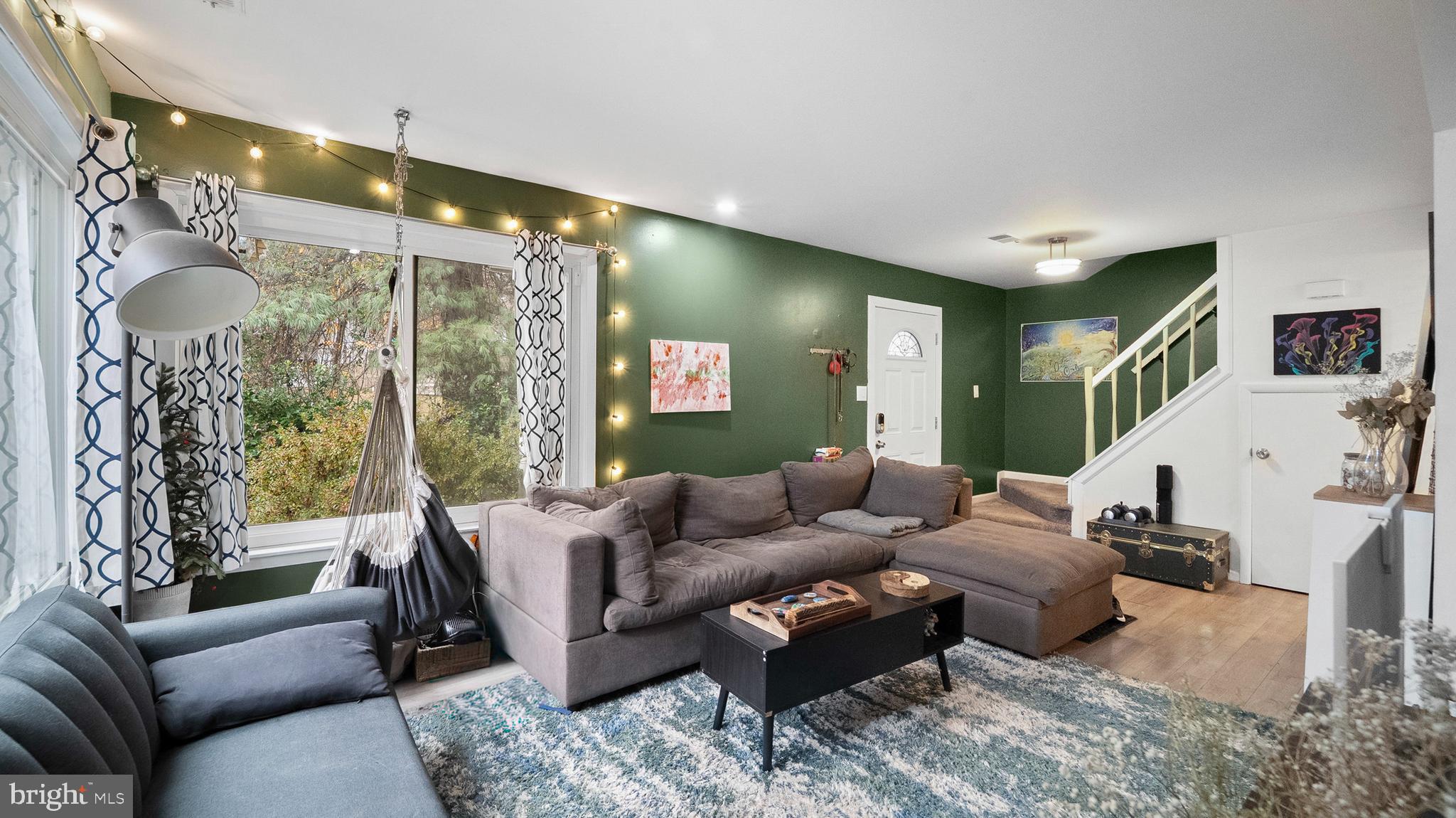 12862 Sage Terrace Germantown, MD 20874 - Photo 20 of 25 a living room with furniture and a large window