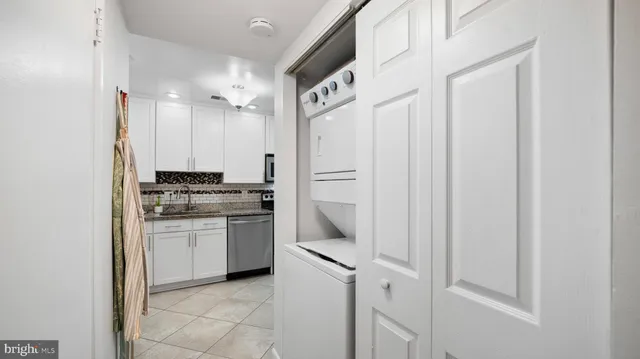 a bathroom with a sink mirror and vanity
