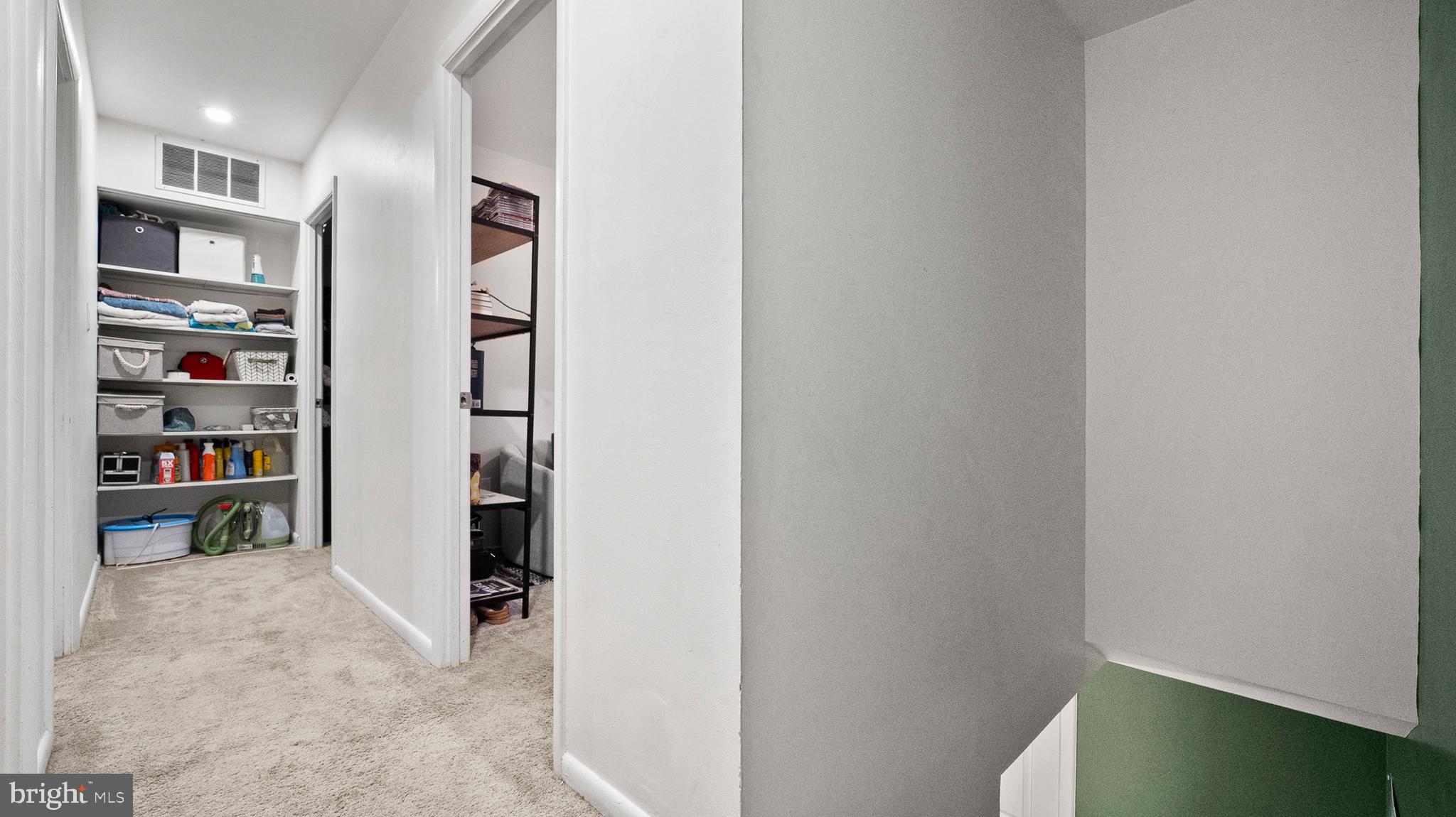 12862 Sage Terrace Germantown, MD 20874 - Photo 6 of 25 a view of a hallway with shelves