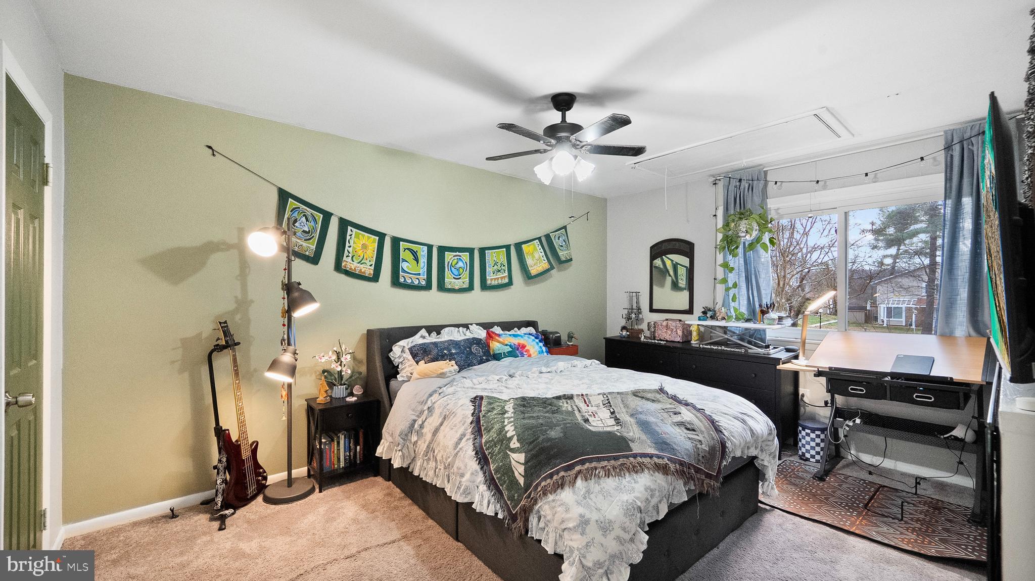 12862 Sage Terrace Germantown, MD 20874 - Photo 7 of 25 a bedroom with a bed ceiling fan and a window