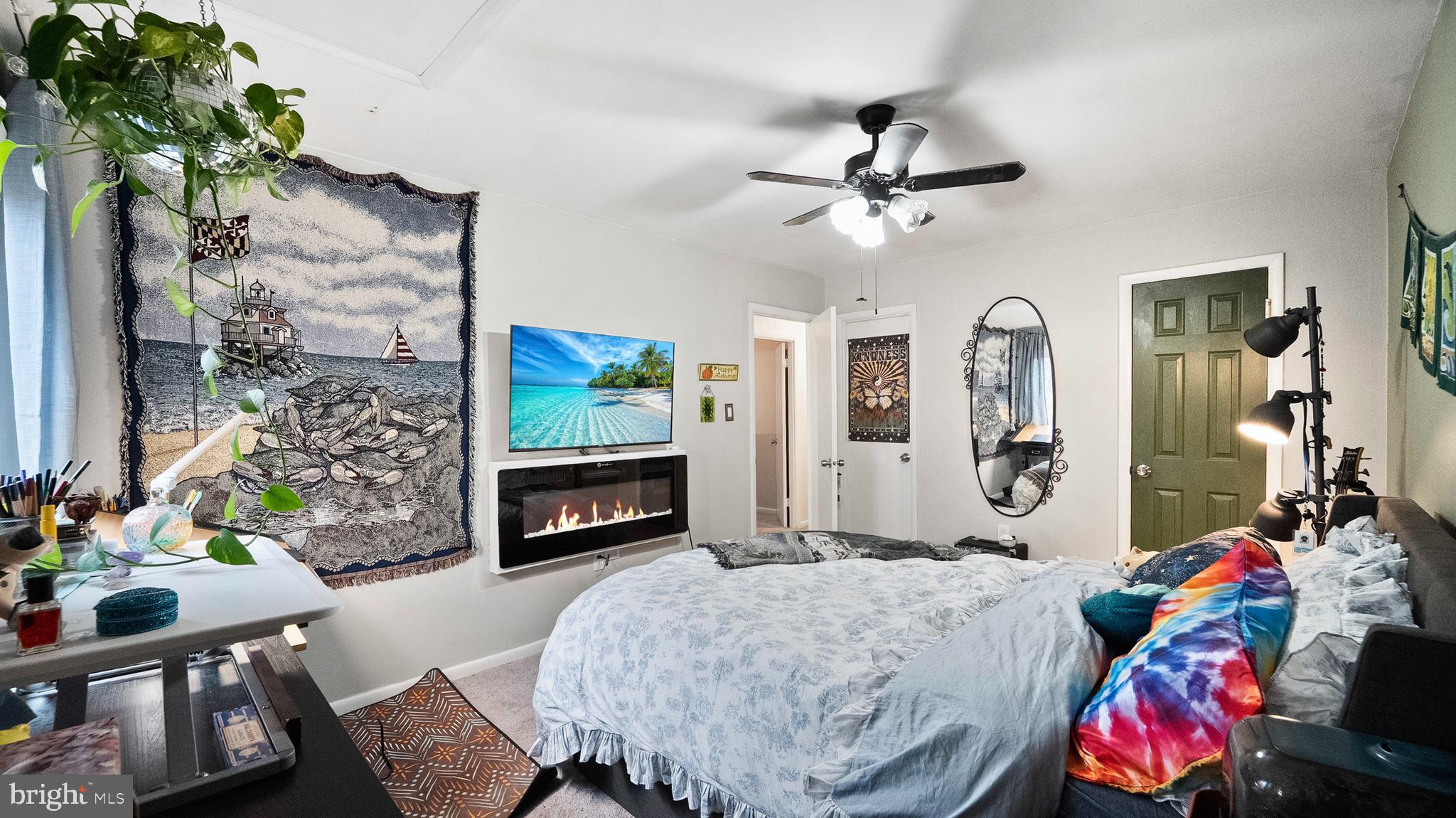 12862 Sage Terrace Germantown, MD 20874 - Photo 8 of 25 a living room with furniture and a flat screen tv
