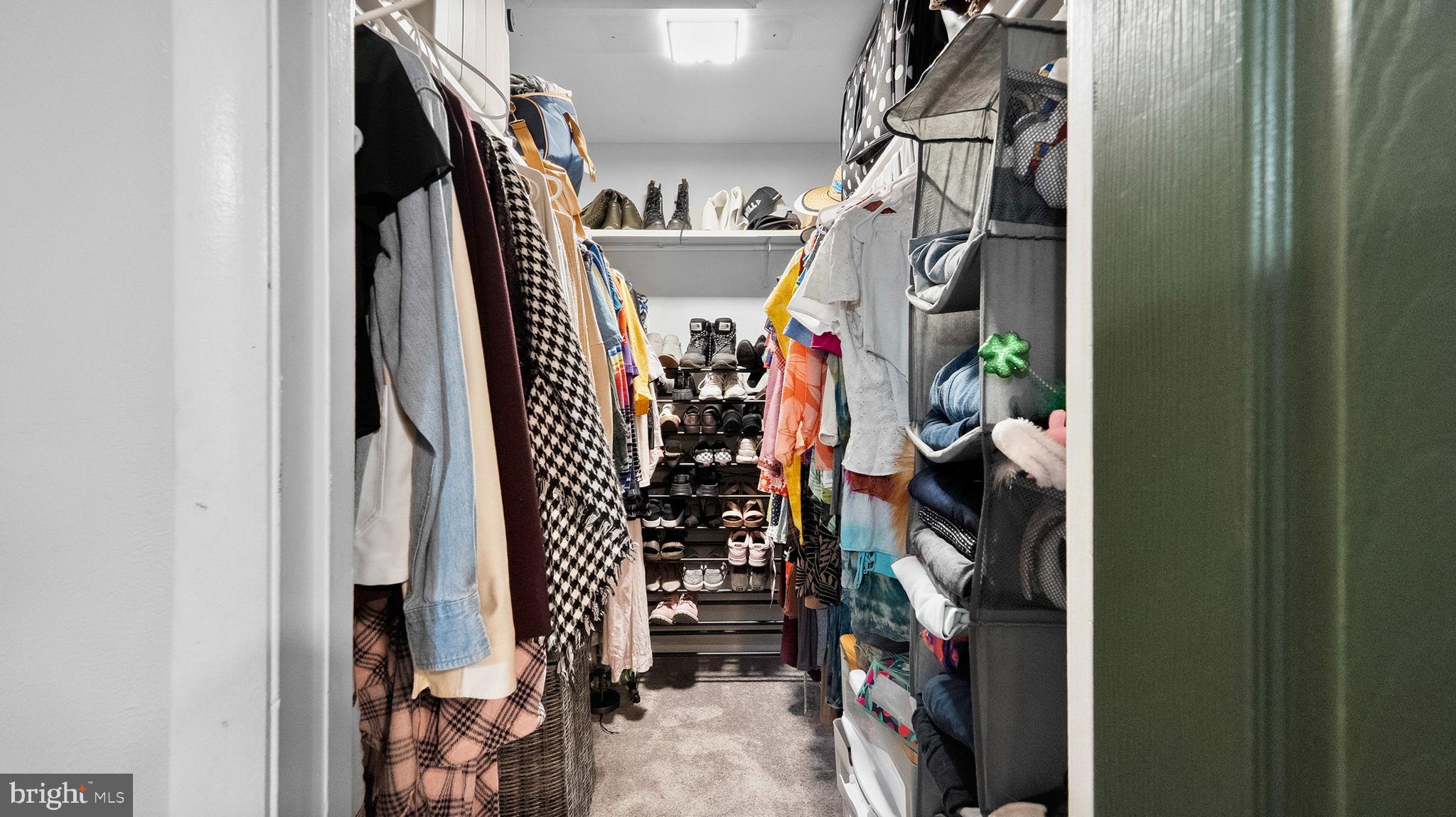 12862 Sage Terrace Germantown, MD 20874 - Photo 9 of 25 a view of walk in closet with clothes and shoes