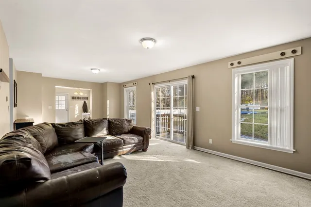 a living room with furniture and windows