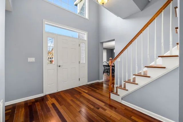 a view of an entryway with wooden floor