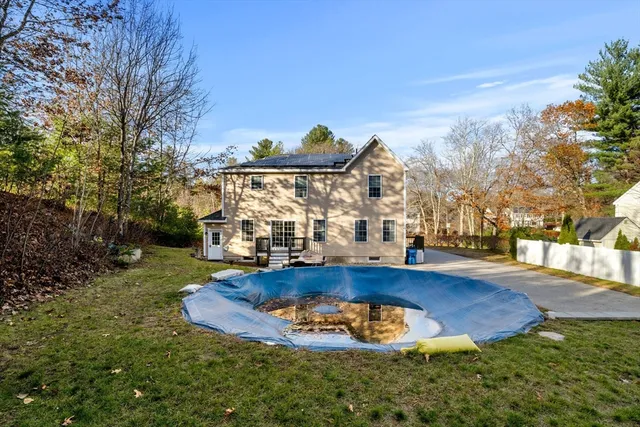a view of a house with swimming pool yard and sitting area