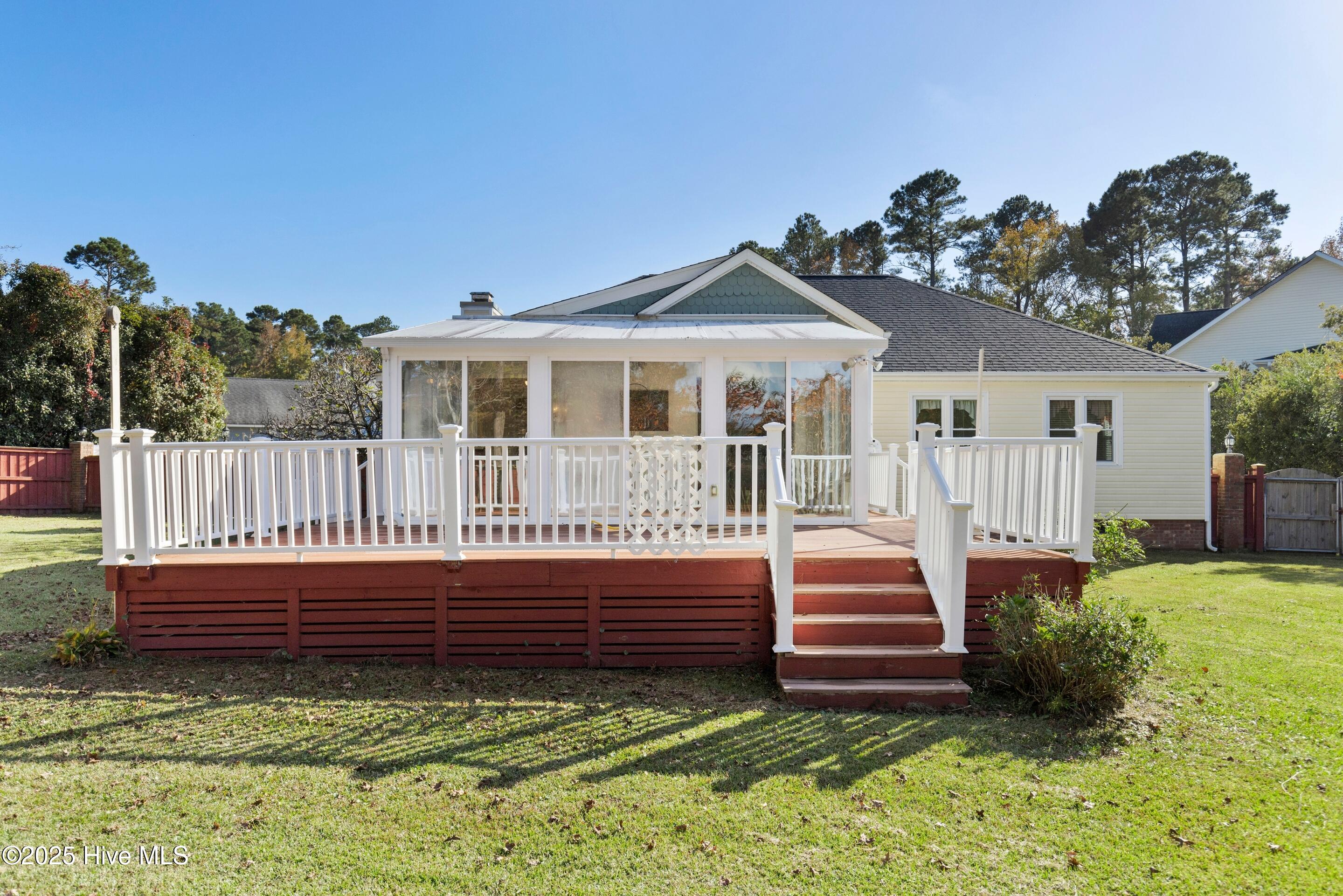 Large deck with gas hookup for a grill and trex decking.