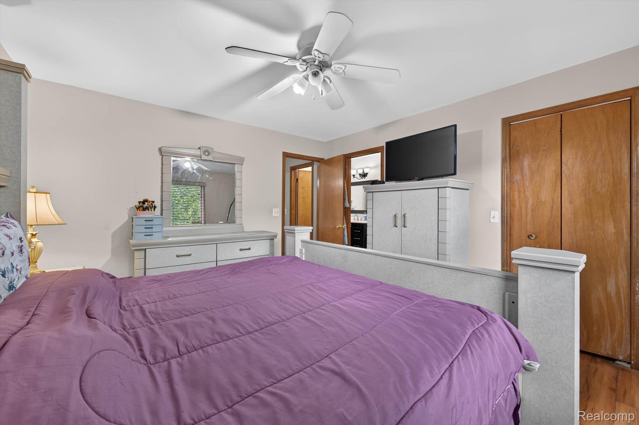 46362 Springhill Drive Utica, MI 48317 - Photo 20 of 59 Neutral wall paint, ceiling fan, and wood-finish flooring