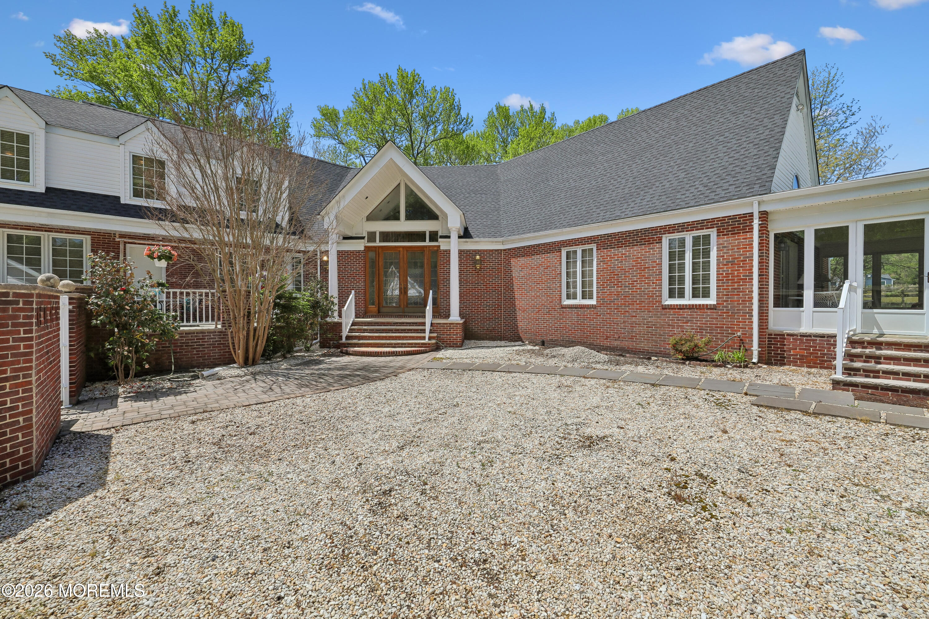187 Hockhockson Road Colts Neck, NJ 07722 - Photo 6 of 55 a front view of a house with a yard