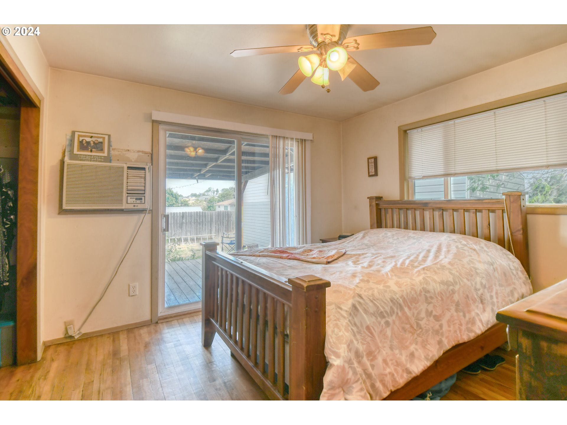824 Southwest 8th Street Pendleton, OR 97801 - Photo 14 of 28 a bedroom with a bed and a chandelier