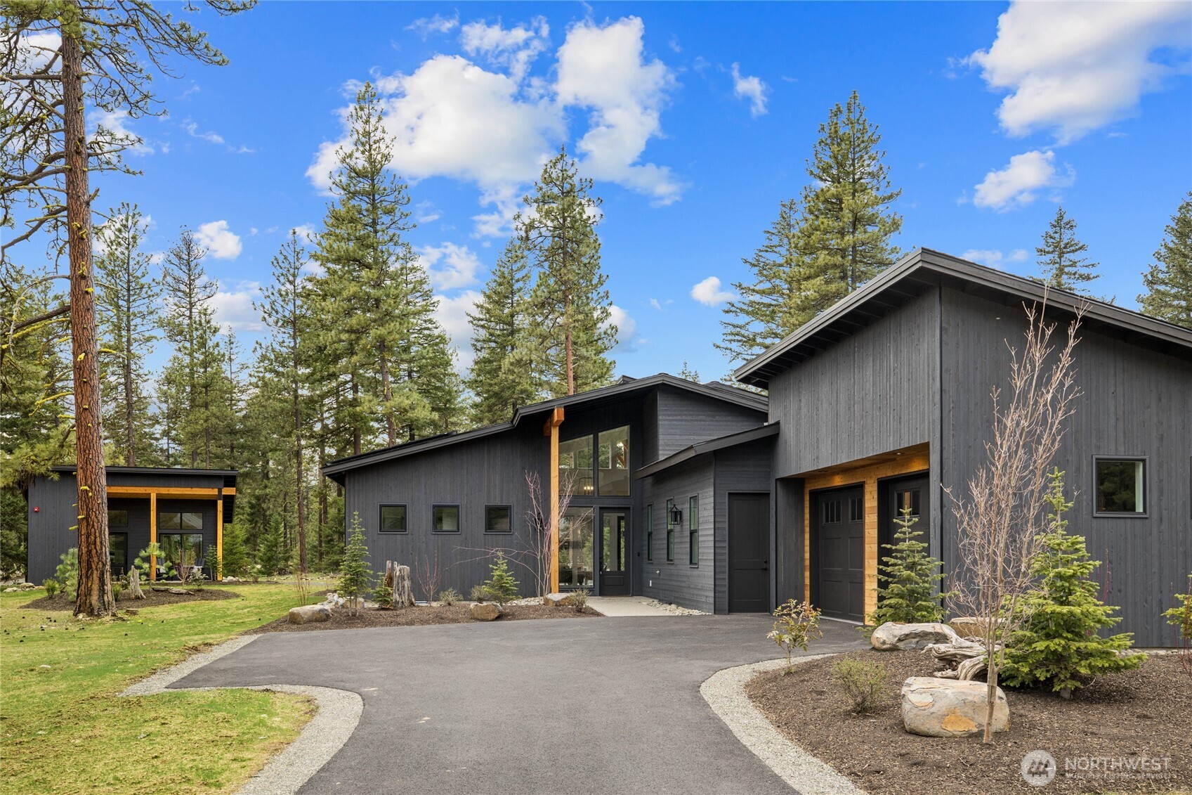 a backyard of a house with yard fire pit and outdoor seating