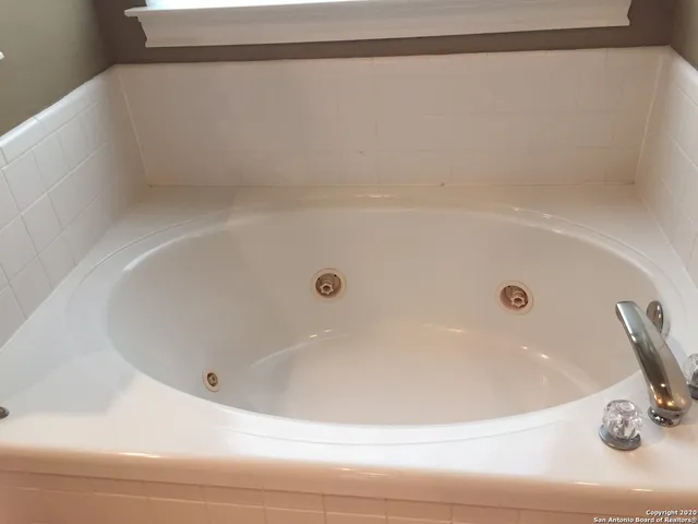 a bathroom with a white bath tub