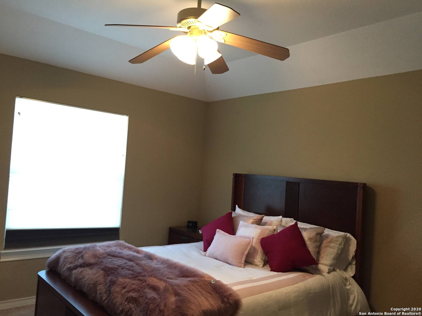 3 Lindquist San Antonio, TX 78248 - Photo 31 of 35 a bedroom with a bed and a chandelier