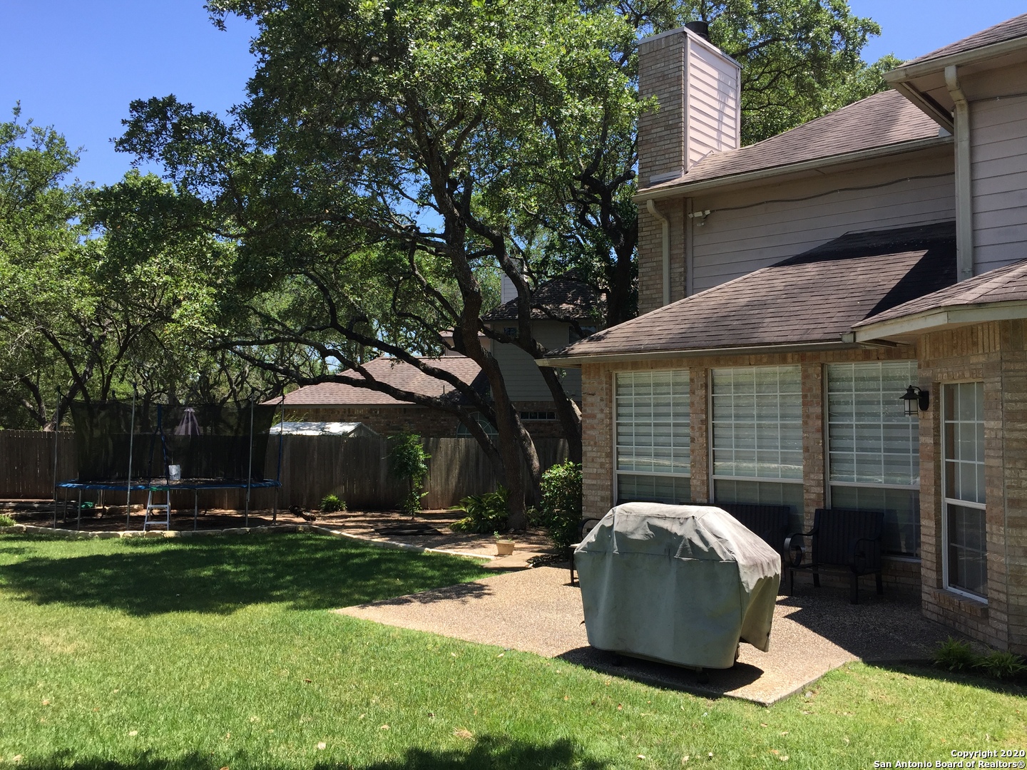 3 Lindquist San Antonio, TX 78248 - Photo 33 of 35 a view of a white house with a yard and large trees