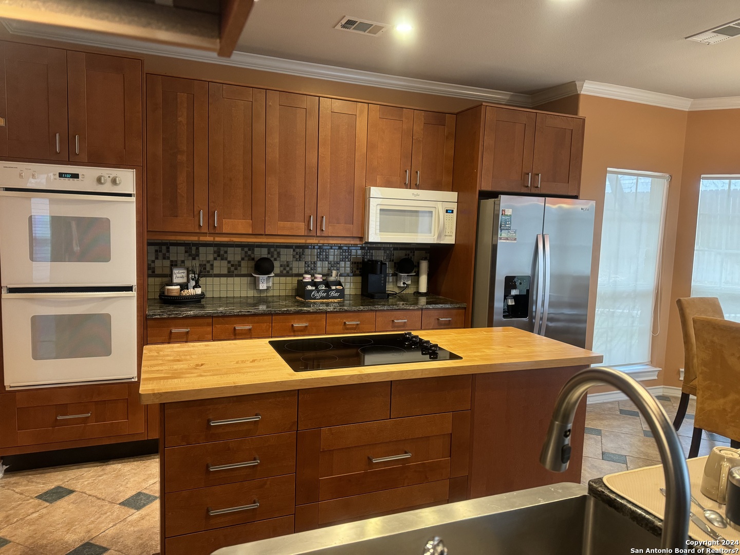 3 Lindquist San Antonio, TX 78248 - Photo 4 of 35 a kitchen with stainless steel appliances granite countertop a refrigerator and a stove top oven